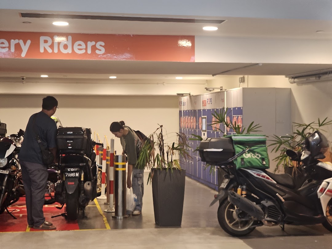 People and delivery riders accessing POPStation lockers in a mall's designated area.