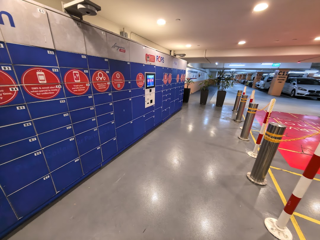 A long row of blue POPStation parcel lockers located in an underground parking area.