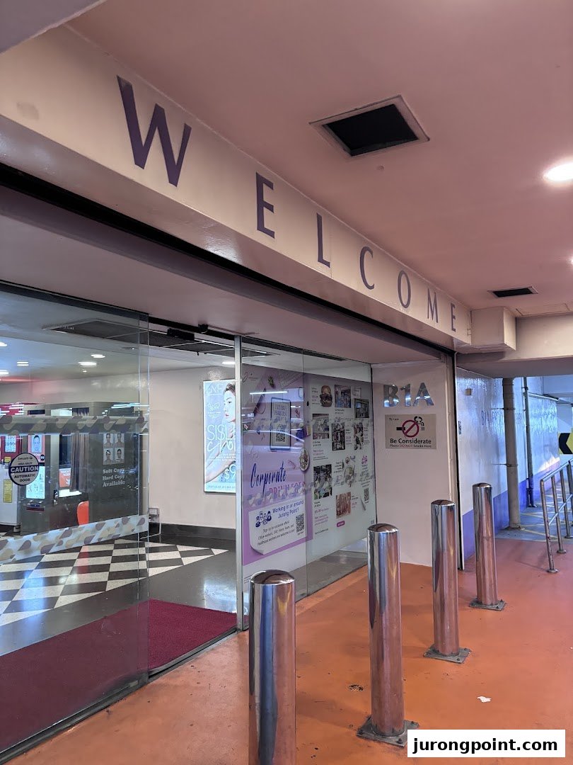 The inviting entrance of POPStation features automatic glass doors and a prominent 'WELCOME' sign.