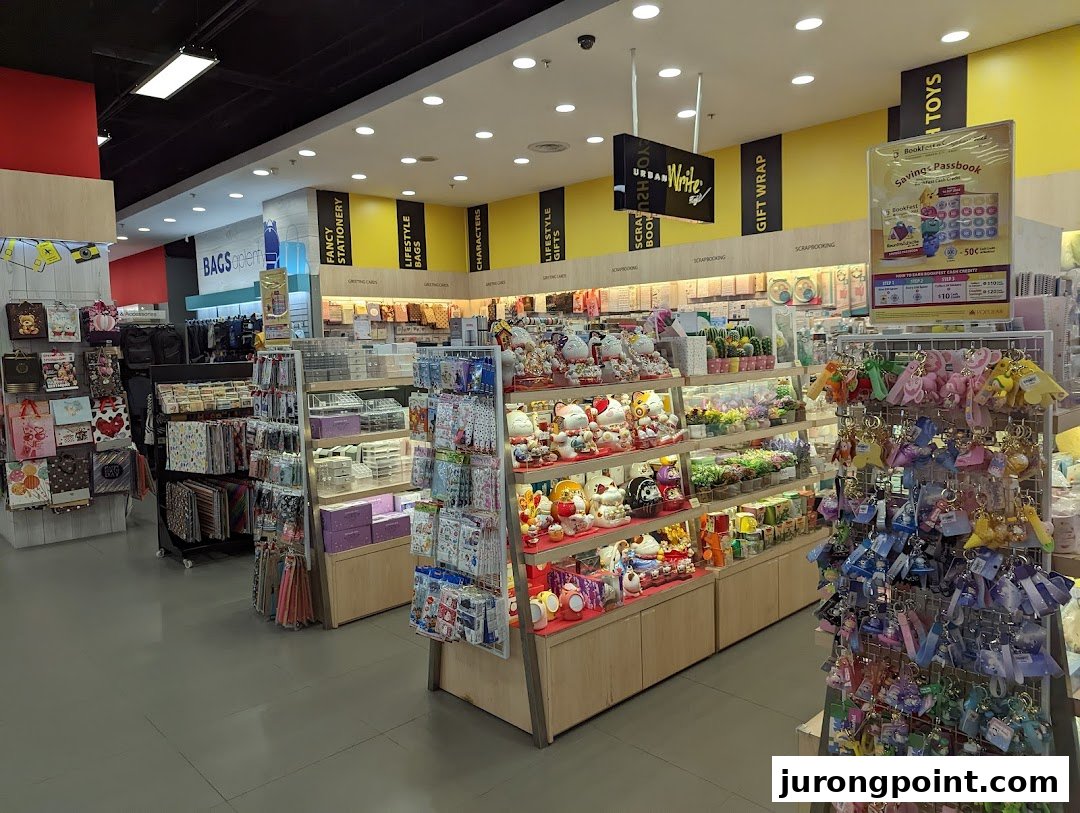 An interior view of POPULAR Bookstore, showcasing diverse sections like stationery, gifts, bags, and toys.