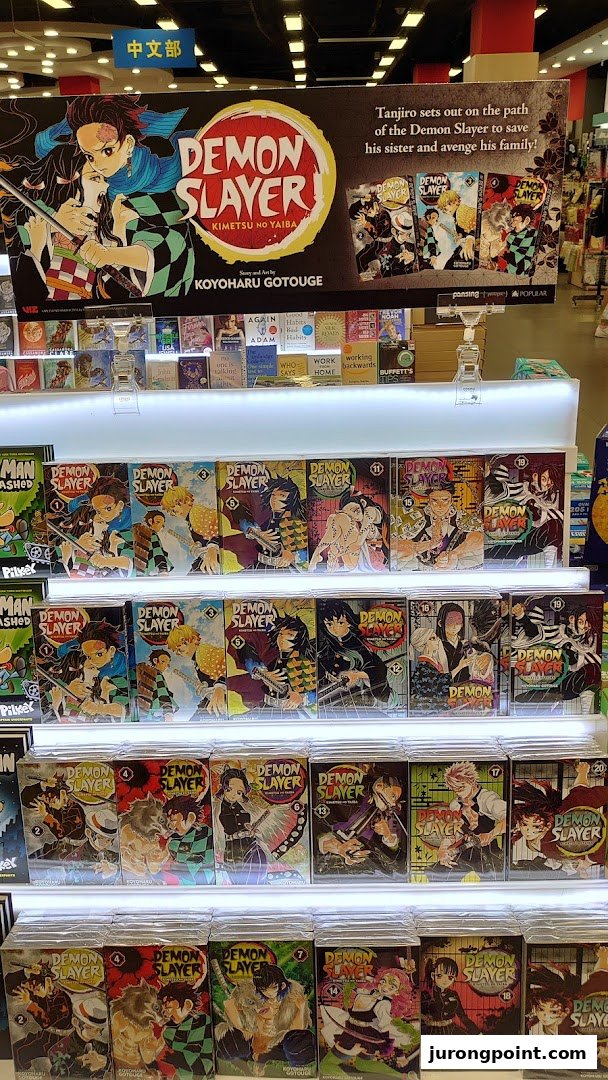 A vibrant display of Demon Slayer manga volumes at POPULAR Bookstore.