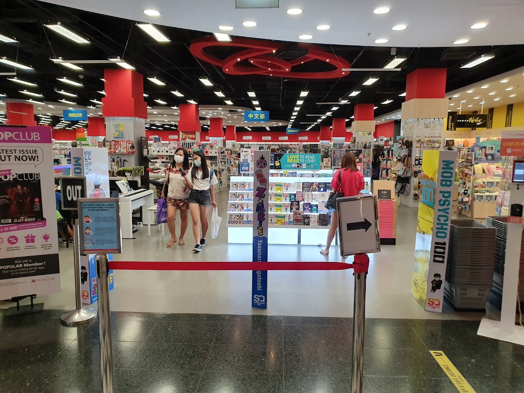 Interior view of POPULAR Bookstore with customers browsing books, stationery, and lifestyle products.