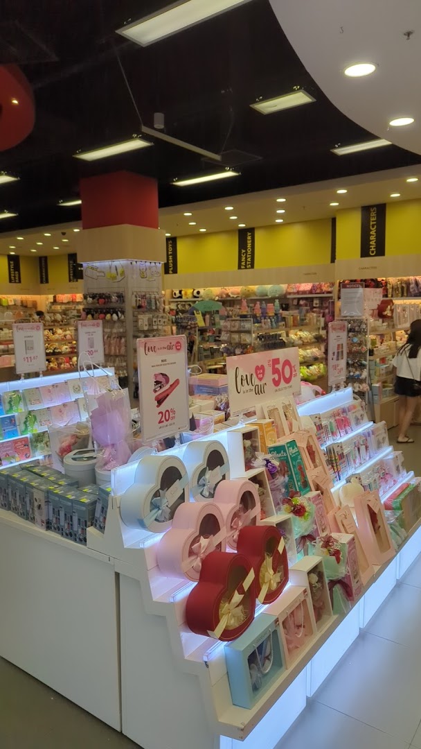 Interior view of POPULAR Bookstore, featuring gift displays, stationery, and plush toys.