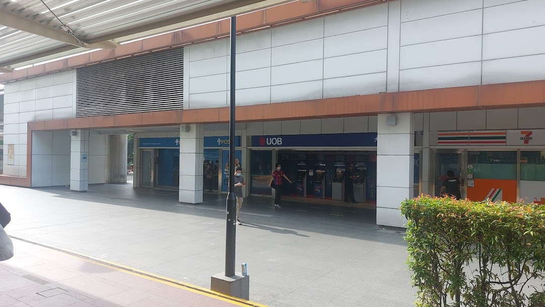 Exterior view of POSB, UOB, and 7-Eleven branches along a mall walkway.