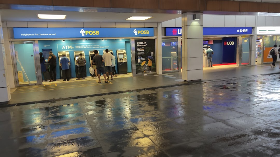People use ATMs at the POSB and UOB banking facilities in Jurong Point.