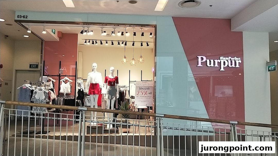Purpur fashion boutique storefront with mannequins, clothing displays, and a prominent sale sign.
