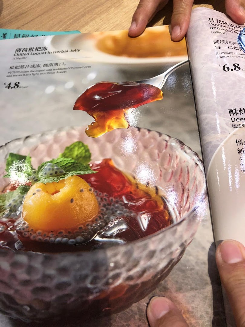 A menu page from PUTIEN showcasing delicious desserts, including Chilled Loquat in Herbal Jelly.