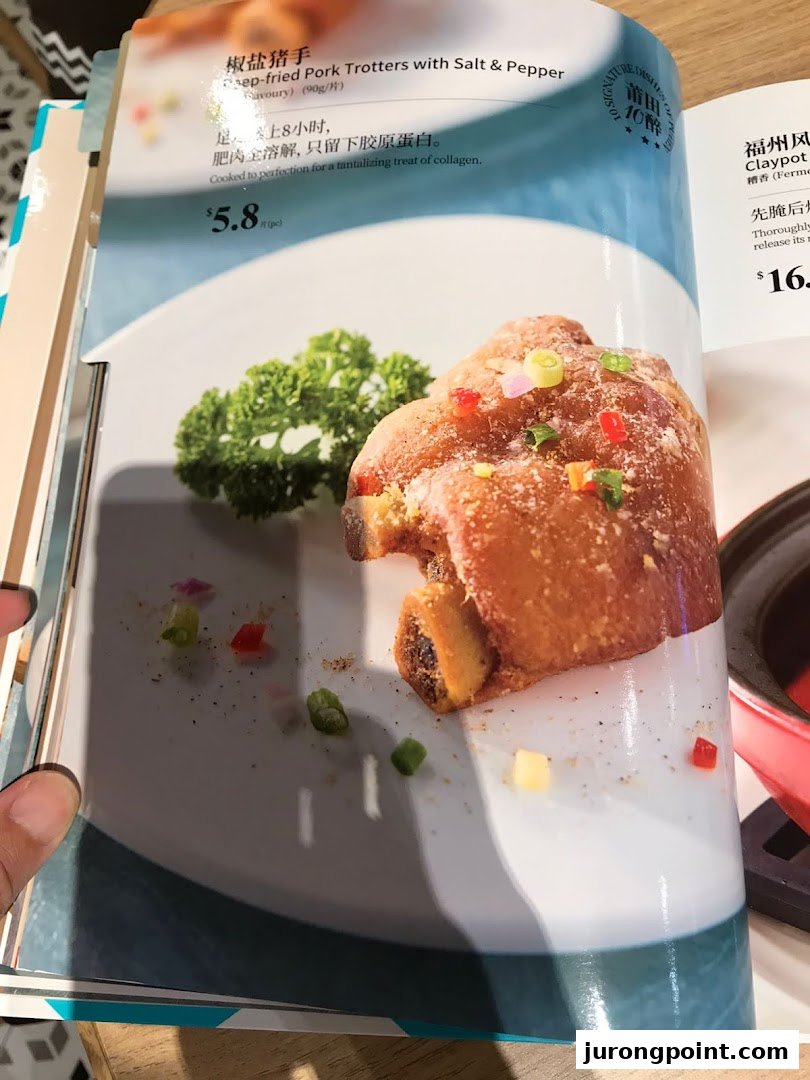 A menu page showcasing PUTIEN's signature Deep-fried Pork Trotters with description and price.