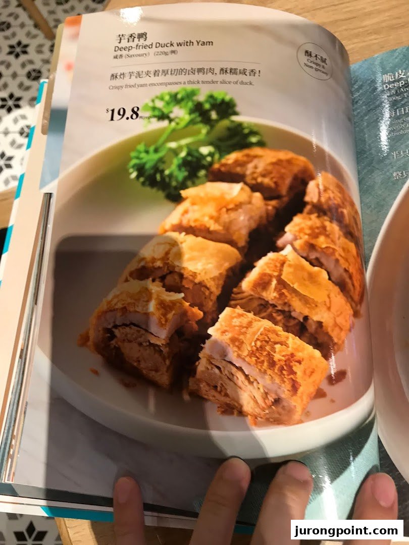 A menu page from PUTIEN showcasing their Deep-fried Duck with Yam dish.