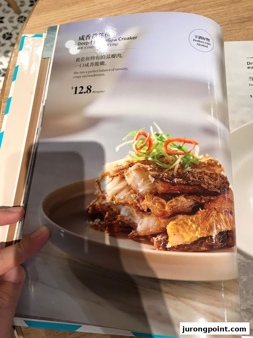 A menu page from PUTIEN featuring a deep-fried yellow croaker dish with its description and price.