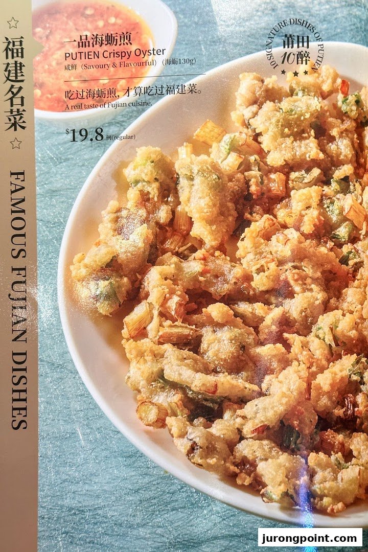 A close-up of PUTIEN's Crispy Oyster dish with menu details and pricing.