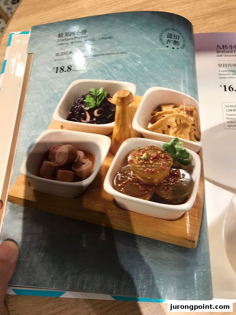 A close-up of a menu page from PUTIEN, featuring a 'Starters Platter' with four distinct small dishes.