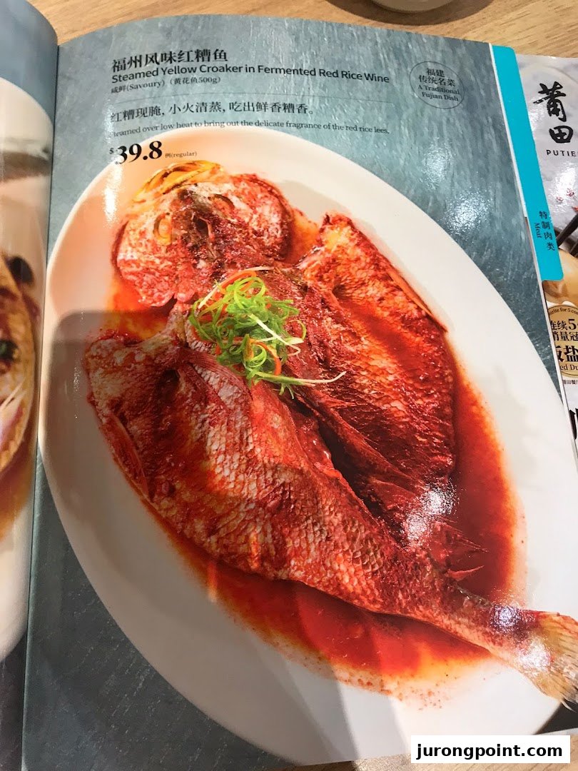 A menu page from PUTIEN showcasing their Steamed Yellow Croaker in Fermented Red Rice Wine dish.