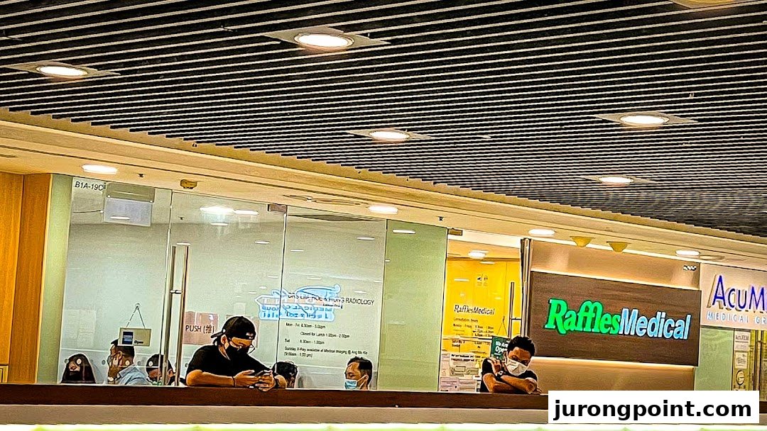 The image shows the shopfronts of RadLink Lite and Raffles Medical clinics within a shopping mall.