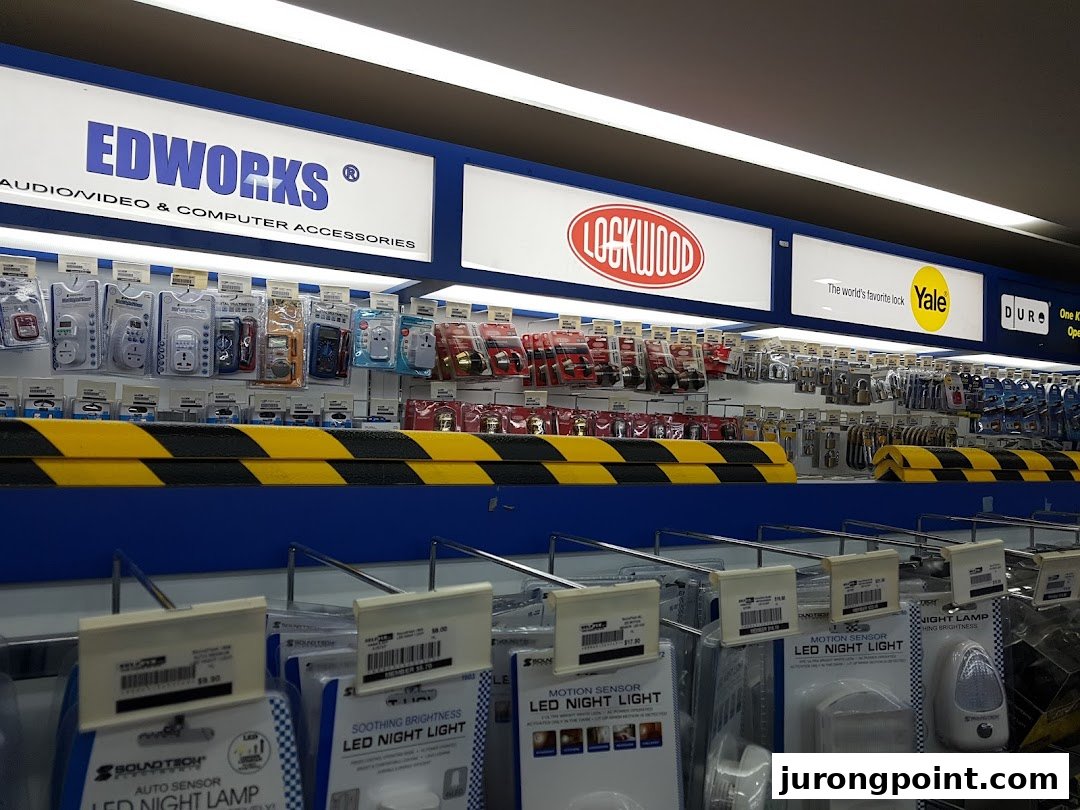 Interior view of Selffix DIY, showcasing shelves filled with home improvement, audio/video, and computer accessories.