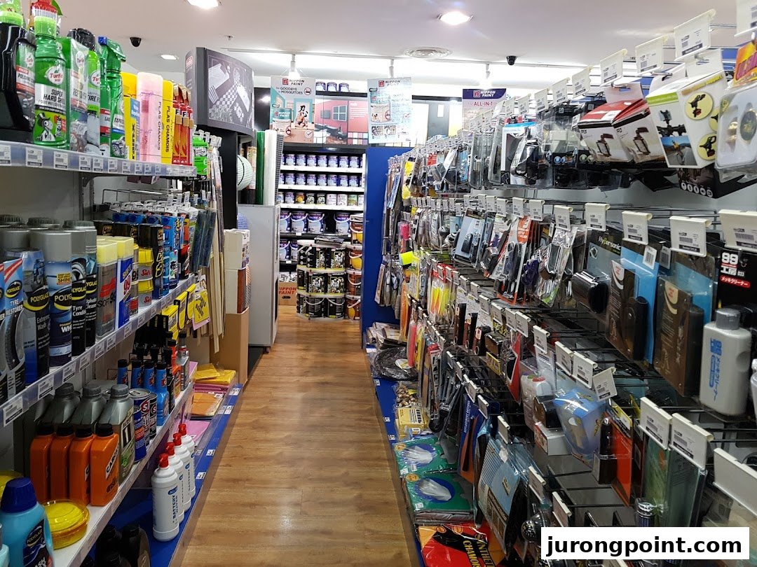 An interior view of Selffix DIY, showcasing shelves filled with car care products, tools, and paint supplies.