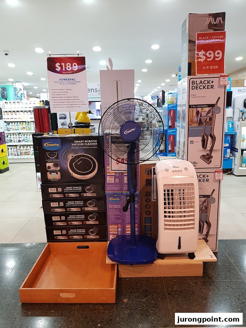 An in-store display featuring smart robotic vacuum cleaners, fans, and air coolers at Selffix DIY.