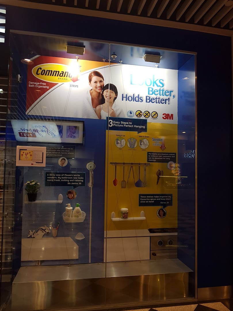 A retail display showcasing Command Brand damage-free hanging solutions for home organization in bathrooms and kitchens.