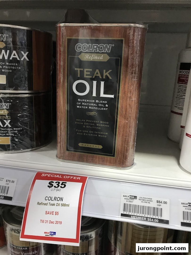 A can of Colron Refined Teak Oil on a retail shelf with a special offer price tag.