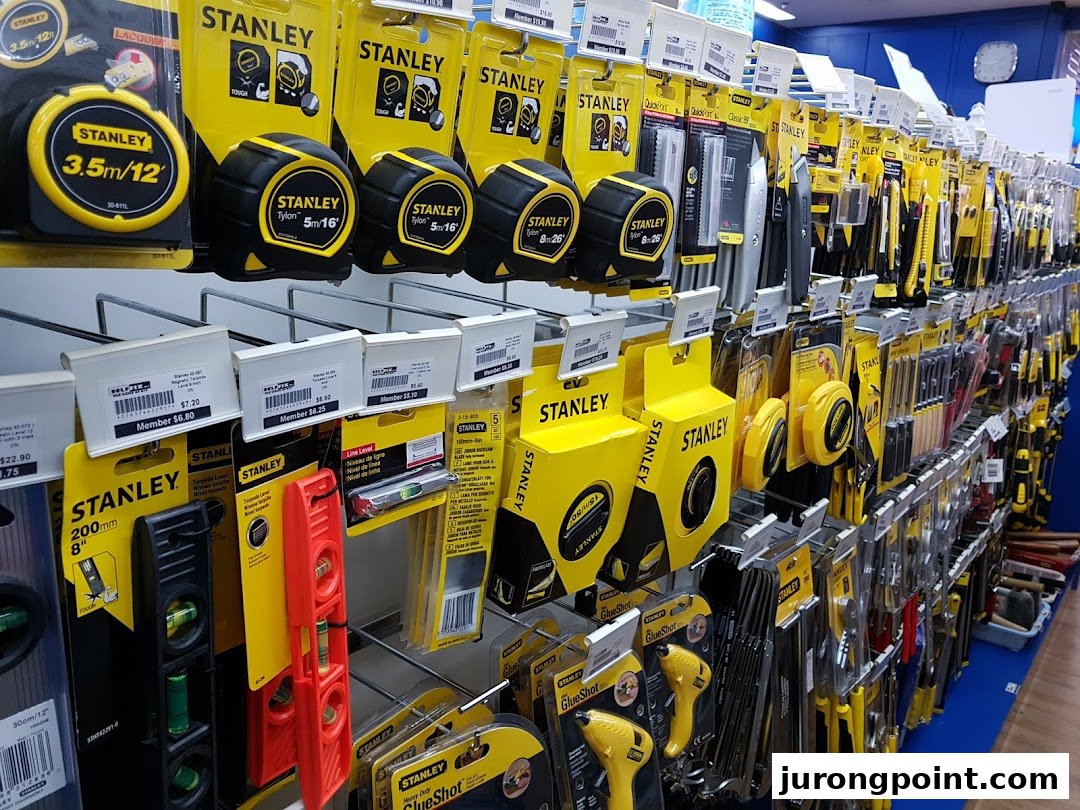 A well-stocked display of Stanley brand tools and hardware, including tape measures, levels, and utility knives.
