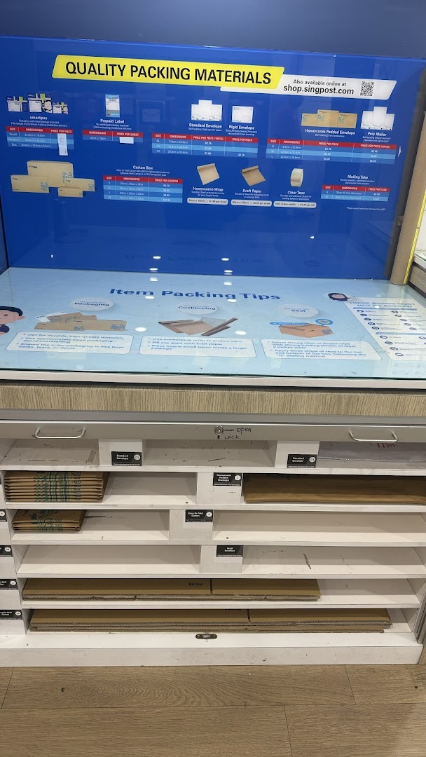 A display stand showcasing various packing materials and their prices at SingPost.