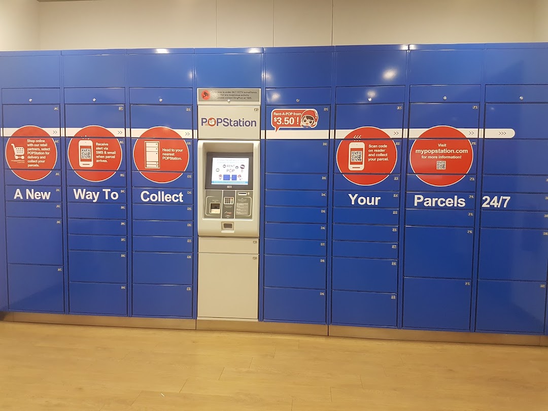 A row of blue POPStation parcel lockers with a central interactive kiosk for 24/7 collection.