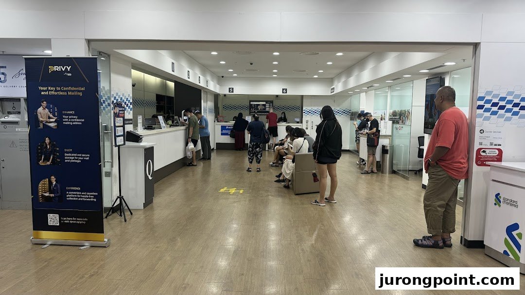 Interior view of Singapore Post - Jurong Point Branch with customers at service counters and in the waiting area.