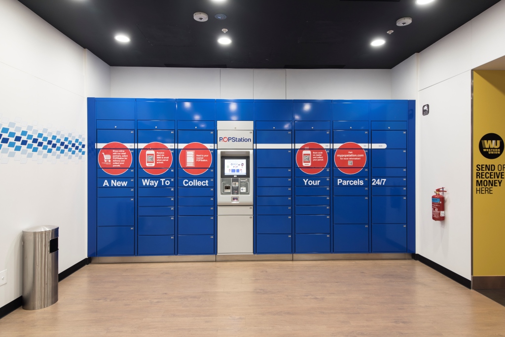 An interior view of Singapore Post's POPStation parcel lockers and a Western Union service point.