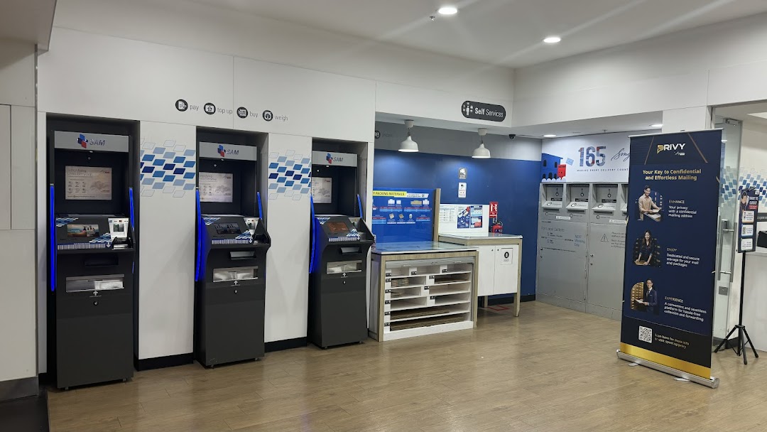 Interior view of Singapore Post's self-service postal kiosks and mailing facilities.