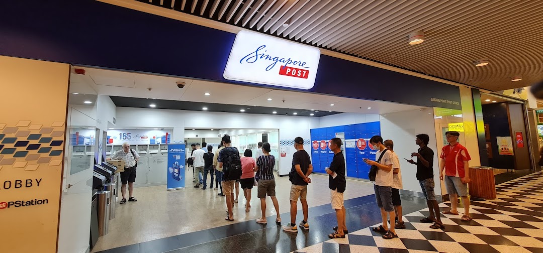 Customers queue inside the Singapore Post Jurong Point branch, offering essential postal services.