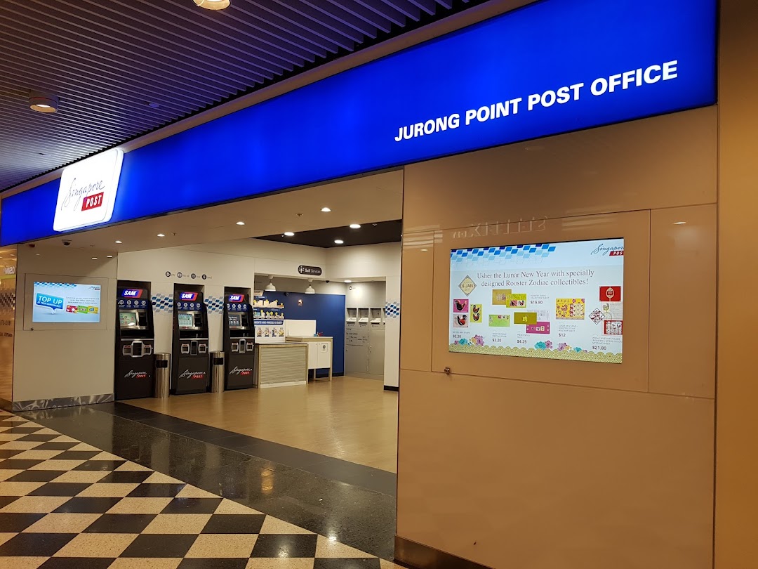 The entrance of Singapore Post at Jurong Point, showcasing self-service machines and a digital display.