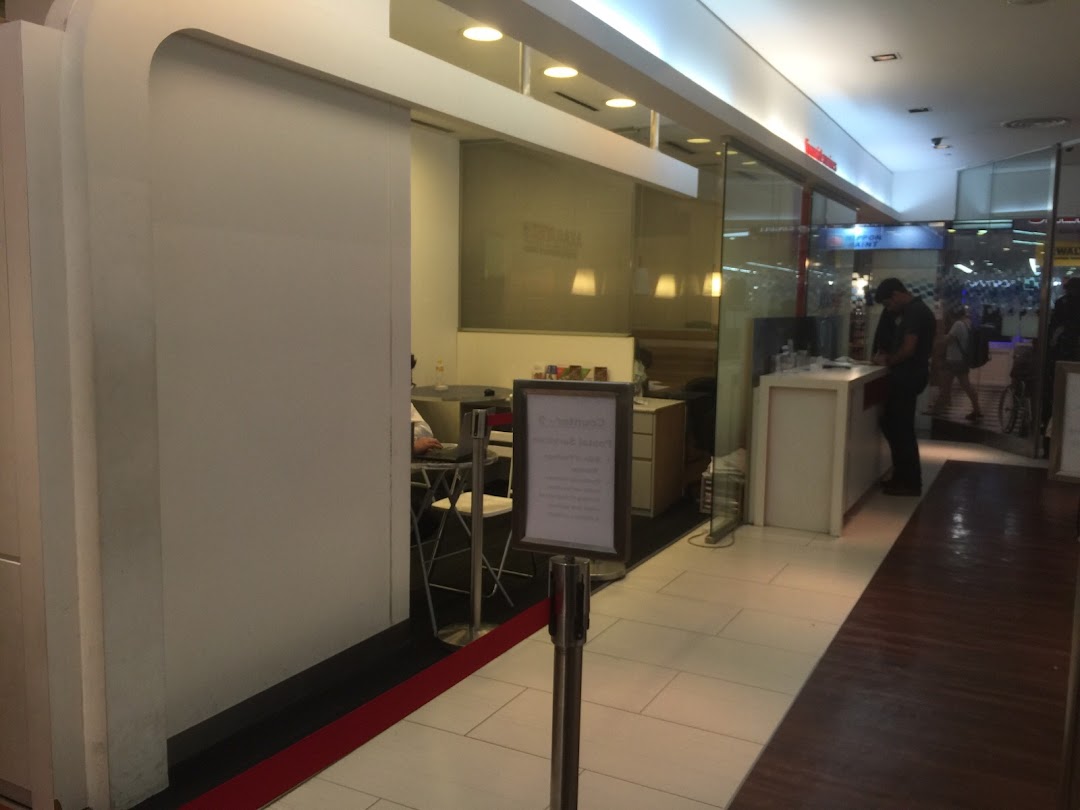 Interior view of Singapore Post's Jurong Point branch, showing the service counter and waiting area.