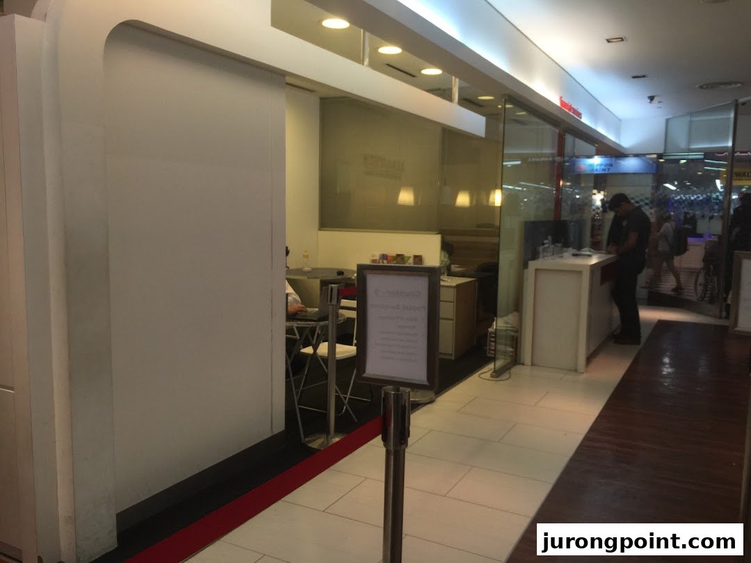 Interior view of Singapore Post's Jurong Point branch, showing the service counter and waiting area.