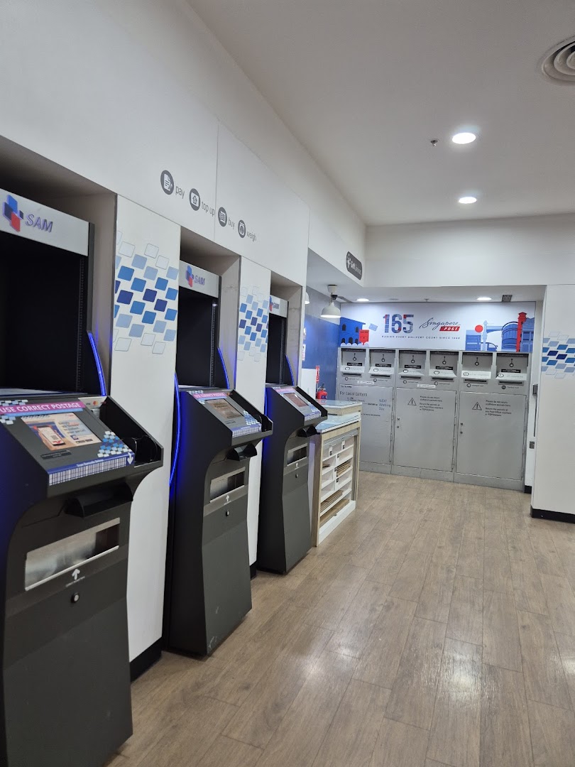 Interior view of Singapore Post featuring self-service SAM kiosks and mailboxes for convenient postal services.