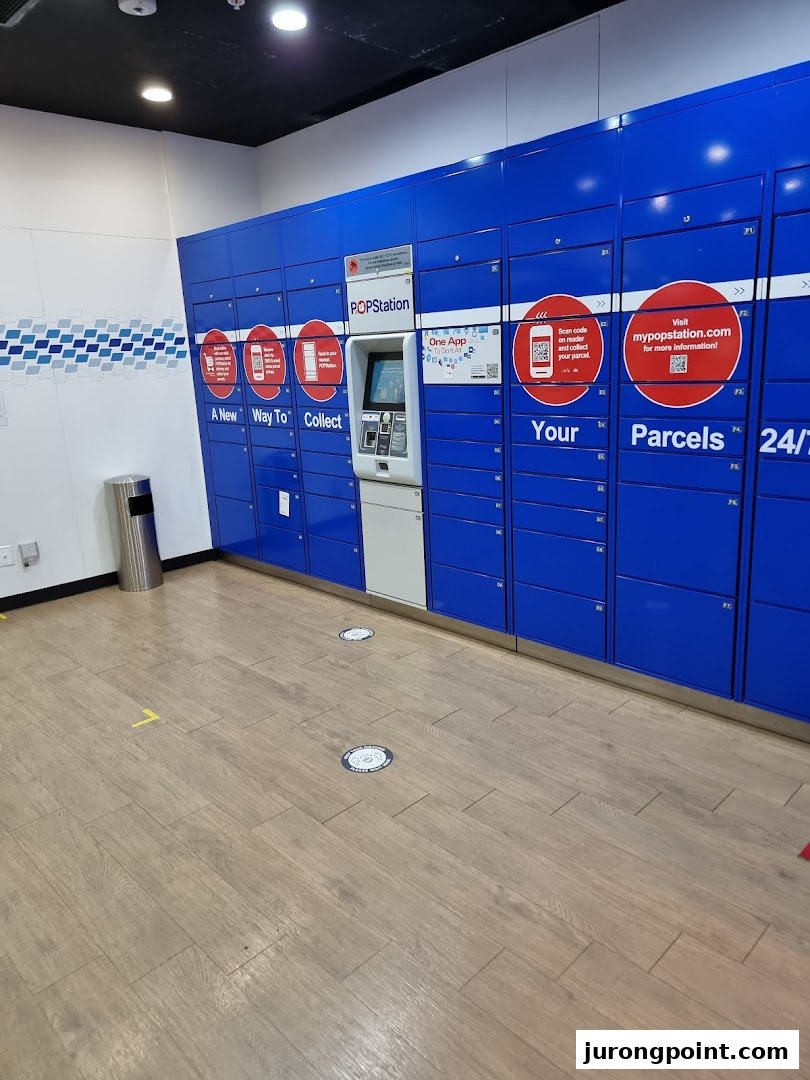 An interior view of blue POPStation parcel lockers with a central kiosk for convenient collection.