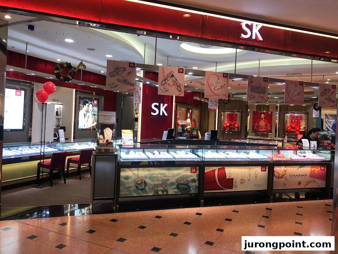 The brightly lit entrance of SK Jewellery showcases sparkling displays of fine jewellery and festive decorations.