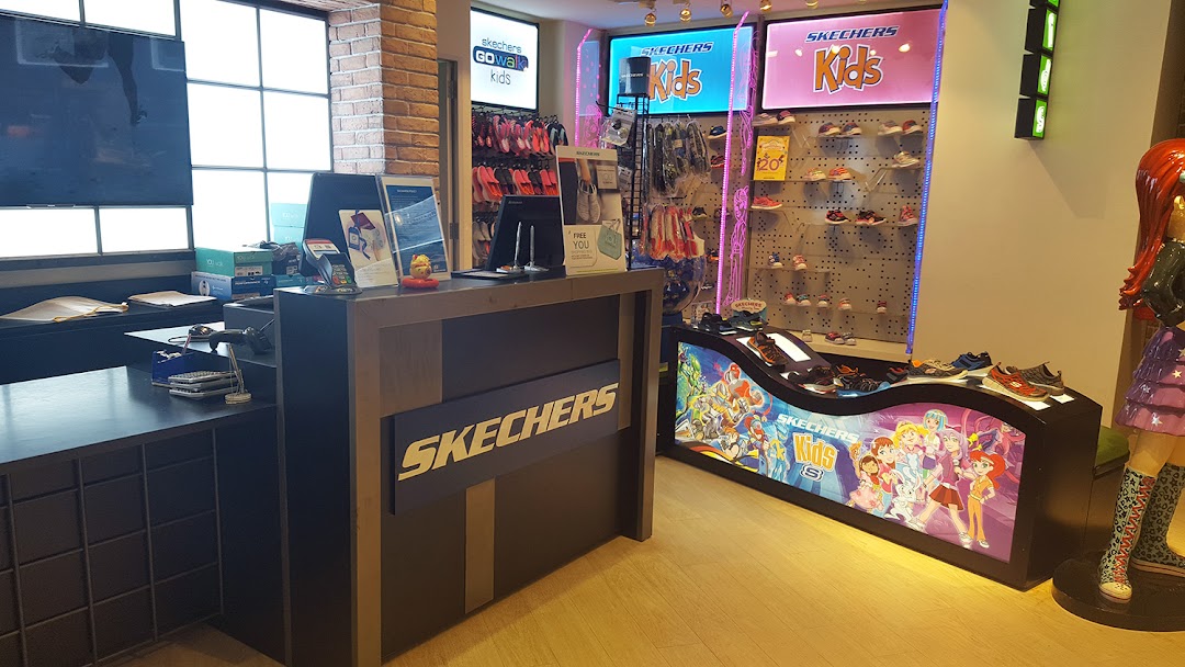 Interior view of a Skechers store, featuring the cashier counter and a vibrant Skechers Kids display.