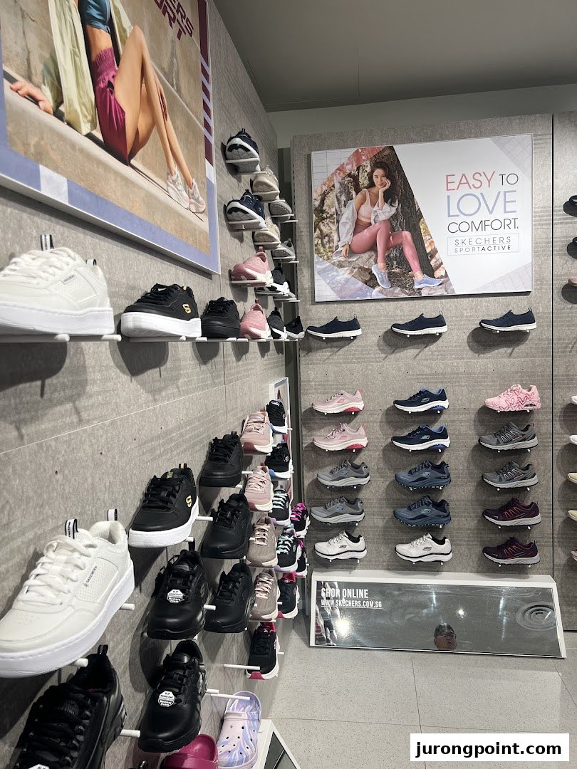 An interior view of a Skechers store showcasing various shoe styles displayed on wall racks.