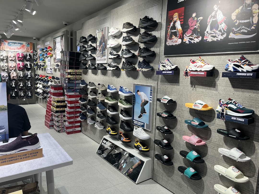 An interior view of a Skechers store showcasing a wide variety of athletic and casual footwear, including sandals and sneakers.