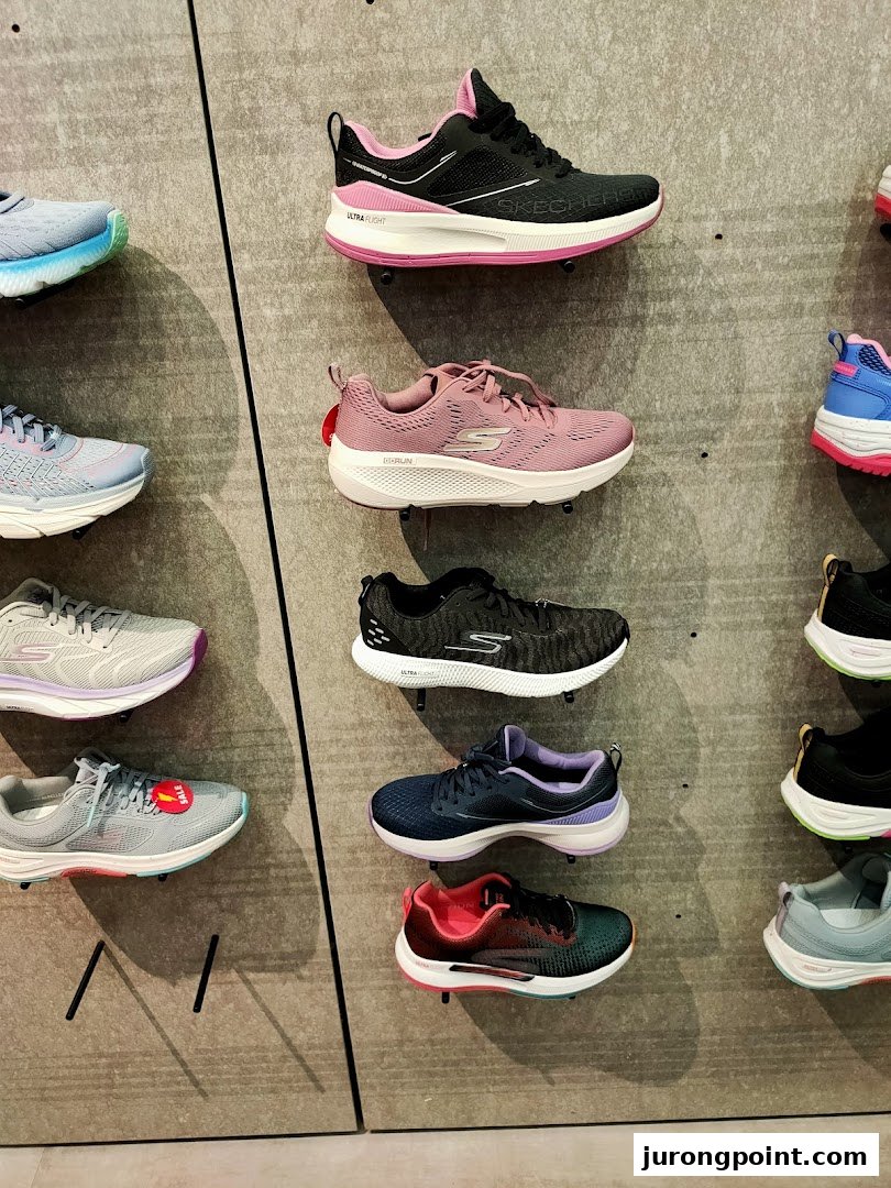 A vibrant display of Skechers athletic shoes in various colors and styles on a textured wall.