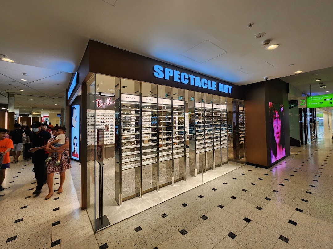The Spectacle Hut storefront showcases a wide array of eyewear and sunglasses in a modern mall setting.