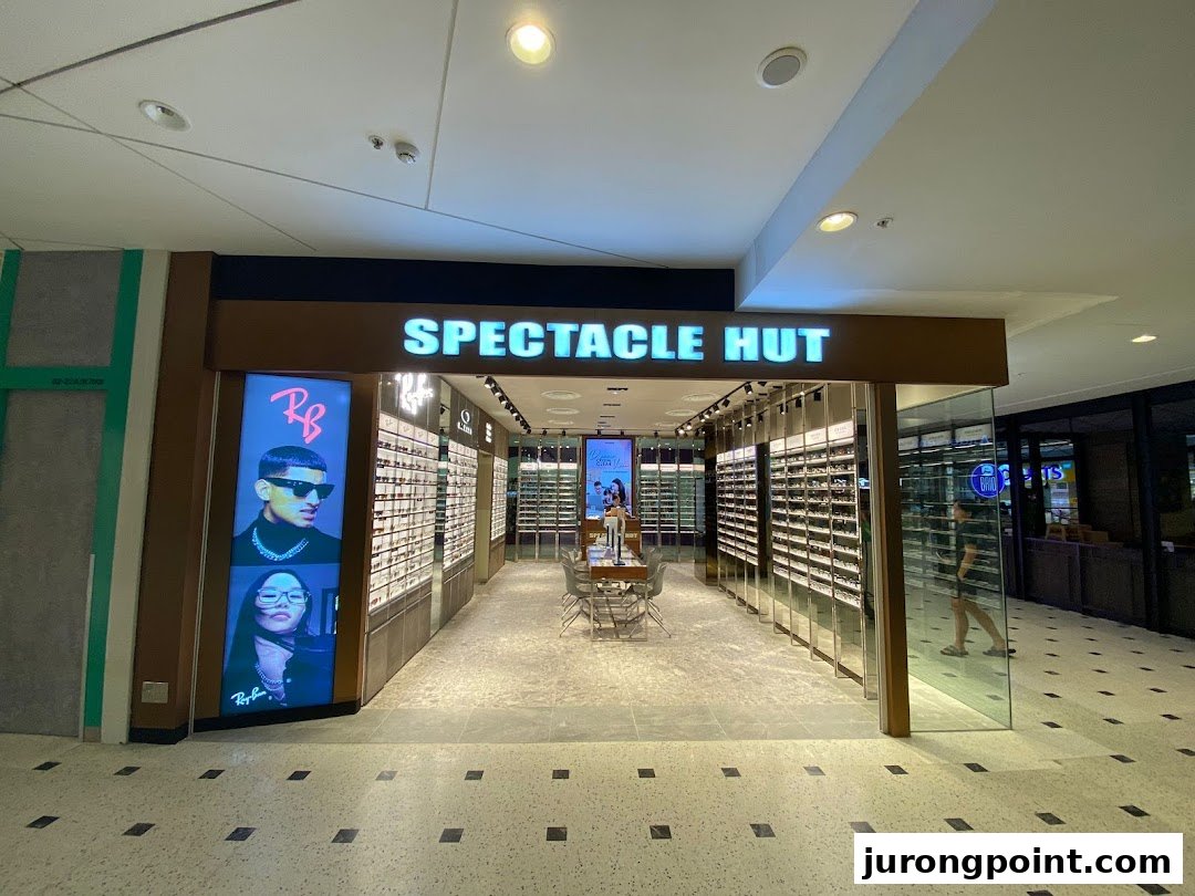 The brightly lit entrance of Spectacle Hut, showcasing a wide array of eyewear and stylish displays.