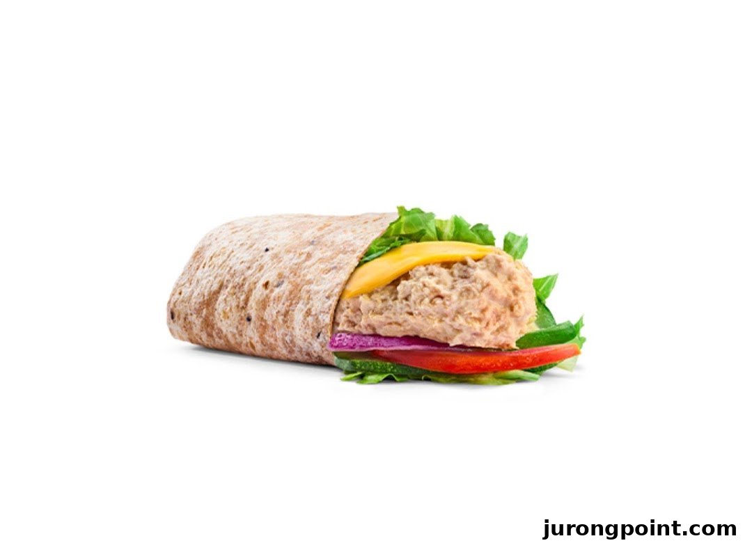 A delicious Subway wrap filled with tuna, cheese, fresh lettuce, red onion, and tomato.