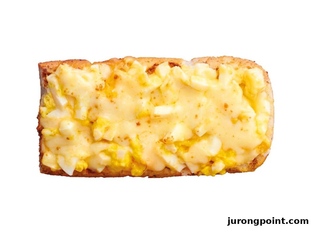 A close-up of a Subway sandwich featuring a creamy egg and cheese filling on toasted bread.