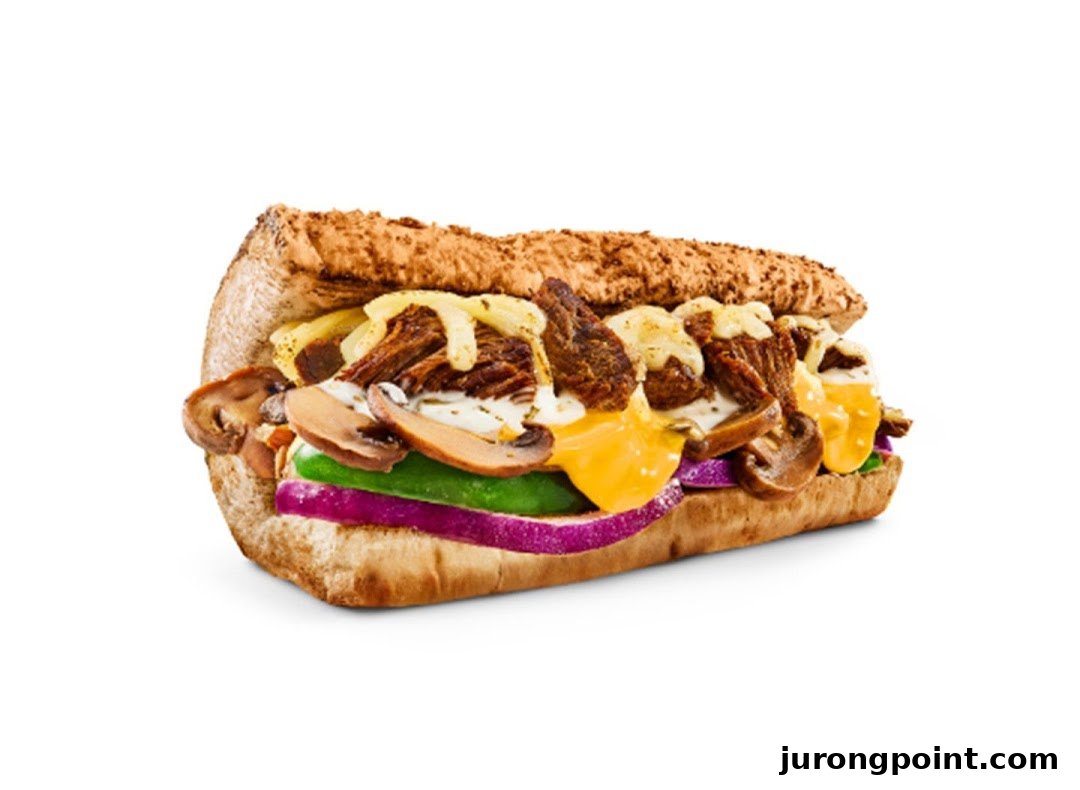 A close-up of a hearty Subway sandwich with meat, cheese, mushrooms, and fresh vegetables.