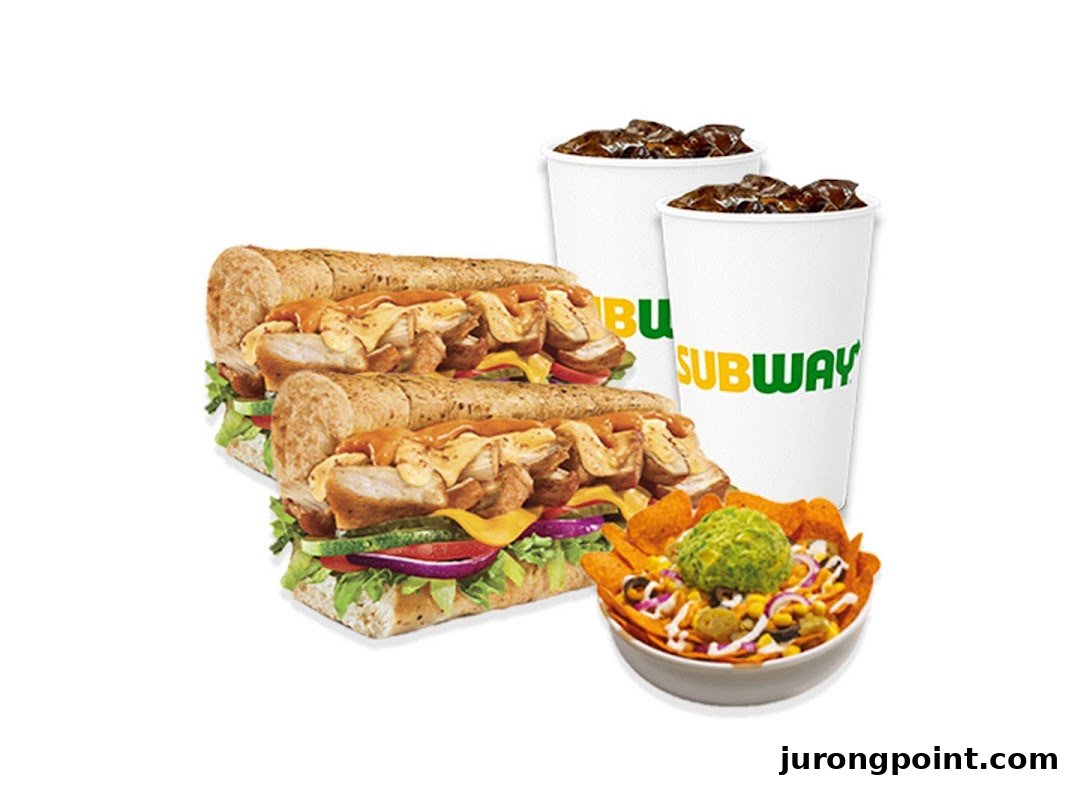A vibrant image showcasing two Subway subs, two drinks, and a bowl of loaded nachos.