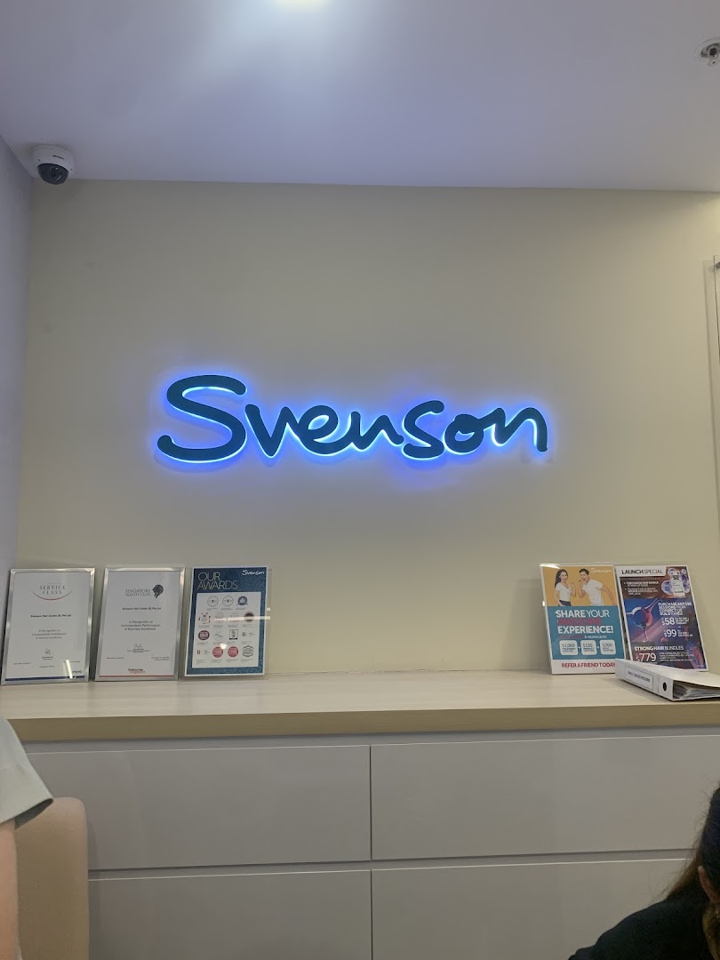 Interior view of Svenson Hair Loss and Scalp Treatment, featuring the illuminated brand logo and reception area.