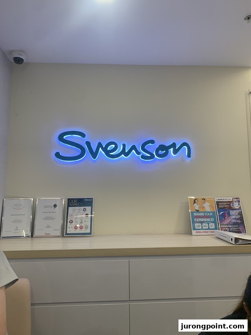 Interior view of Svenson Hair Loss and Scalp Treatment, featuring the illuminated brand logo and reception area.