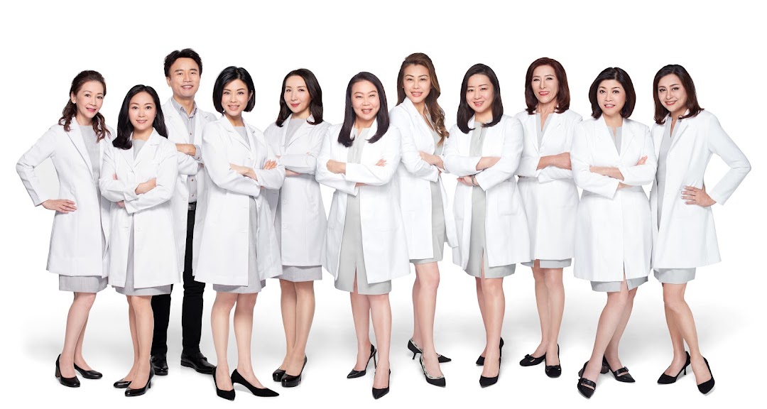 A diverse team of hair and scalp treatment professionals in white lab coats, ready to assist.