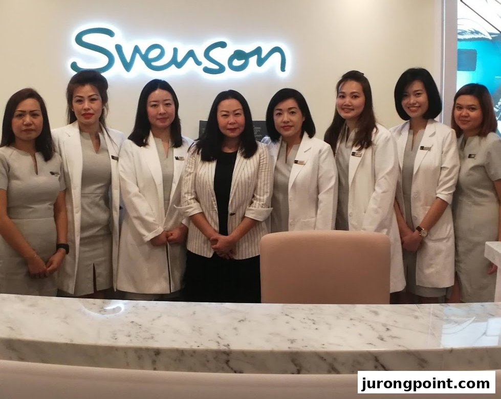 A group of female staff members from Svenson Hair Loss and Scalp Treatment stand together in a modern clinic setting.